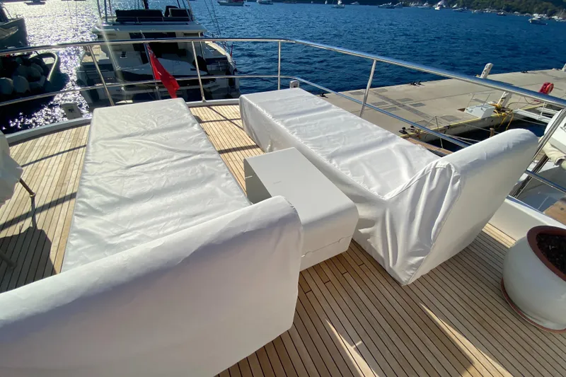  Yacht Photos Pics Luxury deck seating on 2025 Azimut Magellano 66 yacht, overlooking marina.