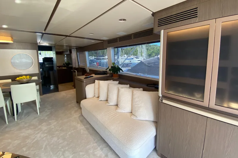  Yacht Photos Pics Luxurious interior of 2025 Azimut Magellano 66 yacht with modern furnishings and large windows.