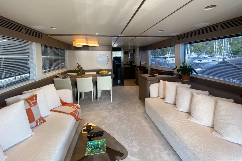  Yacht Photos Pics Luxurious interior of 2025 Azimut Magellano 66 yacht with elegant seating and dining area.