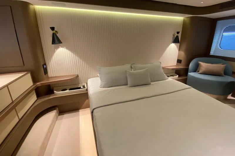  Yacht Photos Pics Luxurious bedroom interior of 2025 Azimut Magellano 66 yacht with modern design.