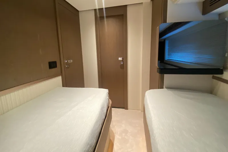  Yacht Photos Pics 2025 Azimut Magellano 66 cabin with twin beds and modern interior design.