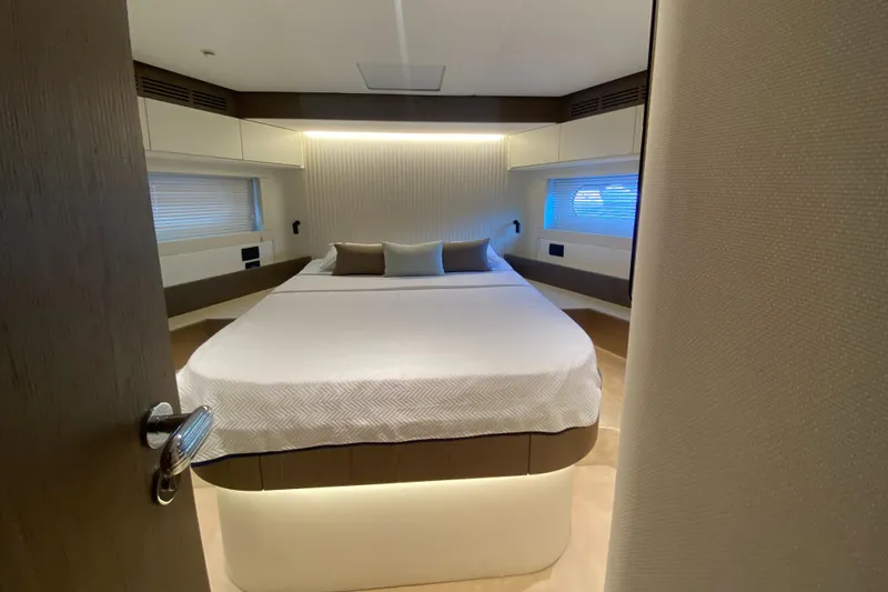 Yacht Photos Pics Luxurious bedroom interior of 2025 Azimut Magellano 66 yacht with modern design.