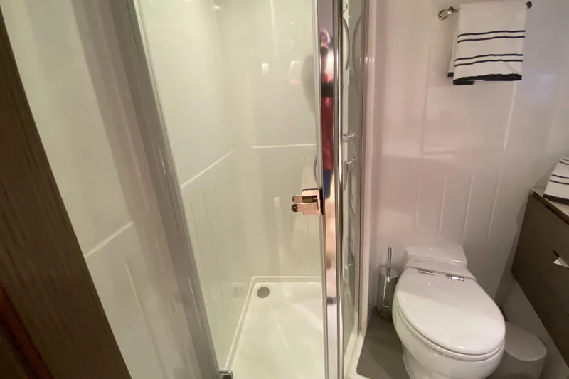  Yacht Photos Pics Bathroom interior of 2025 Azimut Magellano 66 yacht with shower and toilet.