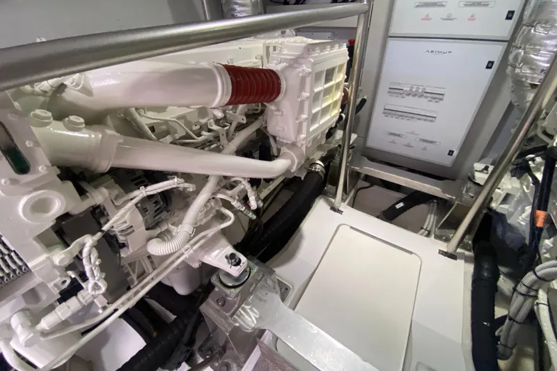  Yacht Photos Pics Engine room of 2025 Azimut Magellano 66 yacht, showcasing mechanical components and systems.