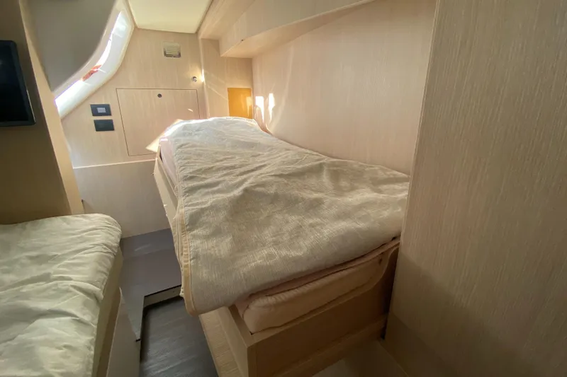  Yacht Photos Pics Interior cabin of 2025 Azimut Magellano 66 yacht with cozy bedding.