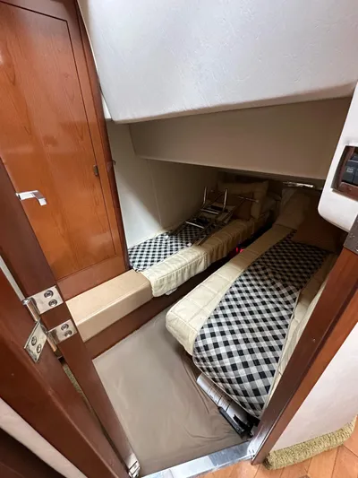  Yacht Photos Pics 2009 Sea Ray 36 Sedan Bridge cabin with twin beds and checkered bedding.