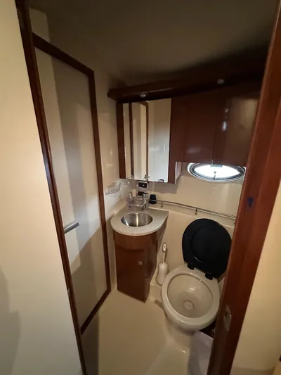  Yacht Photos Pics 2009 Sea Ray 36 Sedan Bridge bathroom with sink, toilet, and mirror.