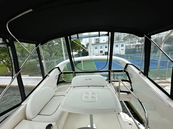  Yacht Photos Pics 2009 Sea Ray 36 Sedan Bridge interior with seating and table, overlooking tennis courts.