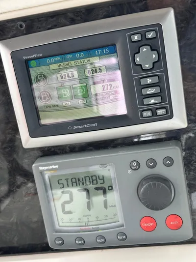  Yacht Photos Pics Control panel of 2009 Sea Ray 36 Sedan Bridge with navigation displays.