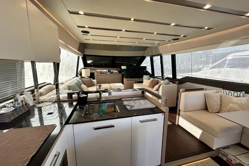  Yacht Photos Pics Luxurious interior of a 2017 Prestige 680 yacht with modern furnishings and spacious layout.