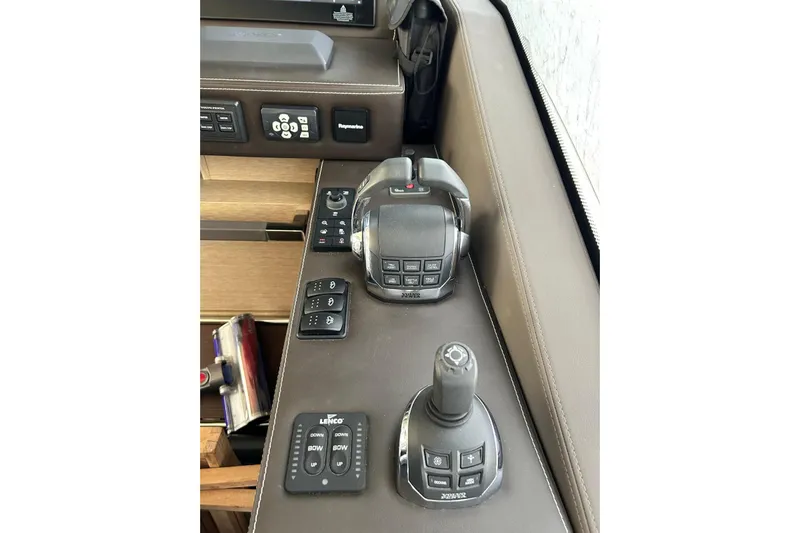  Yacht Photos Pics Control panel of a 2017 Prestige 680 yacht, featuring navigation and throttle controls.