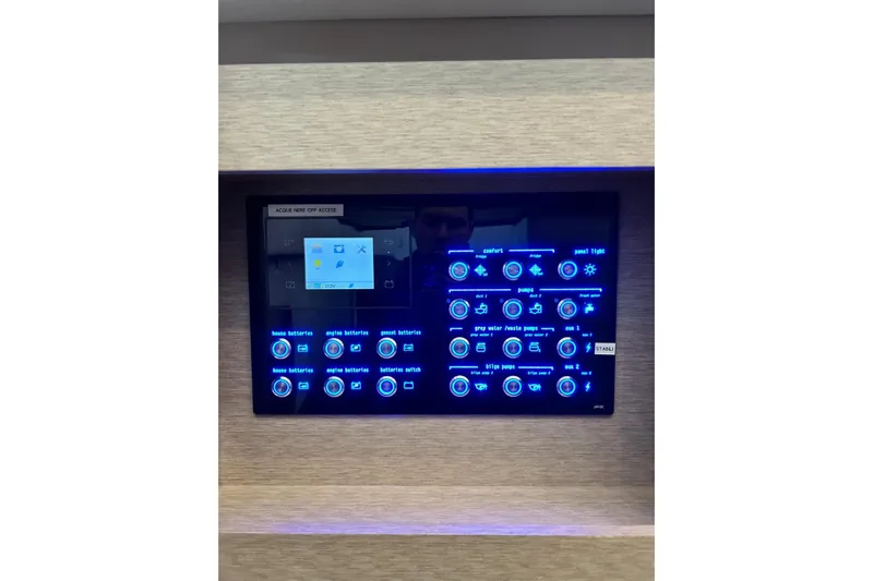  Yacht Photos Pics Control panel of a 2017 Prestige 680 yacht with illuminated buttons and digital display.