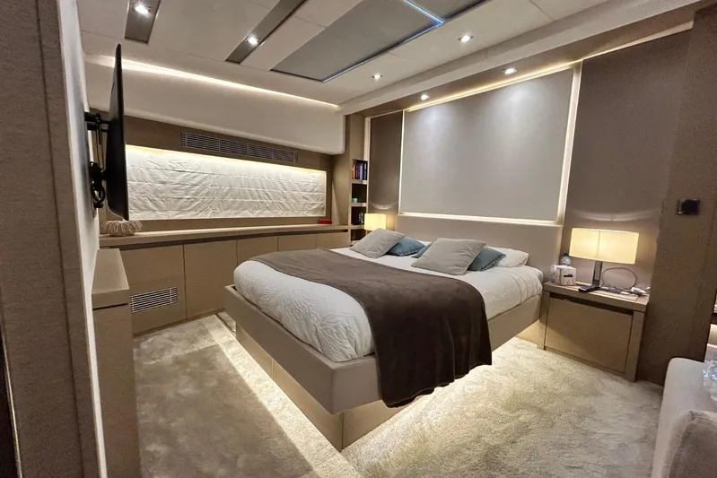  Yacht Photos Pics Luxurious bedroom interior on a 2017 Prestige 680 yacht, featuring modern design and ambient lighting.