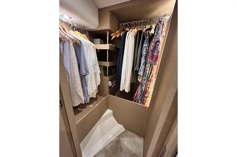  Yacht Photos Pics Luxurious closet in 2017 Prestige 680 yacht with hanging clothes and shelves.
