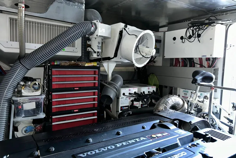  Yacht Photos Pics Engine room of a 2017 Prestige 680 yacht with Volvo Penta engine and tool storage.