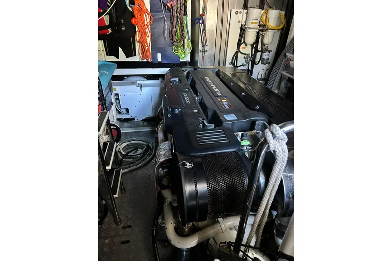  Yacht Photos Pics Engine room of a 2017 Prestige 680 yacht, showcasing equipment and storage.