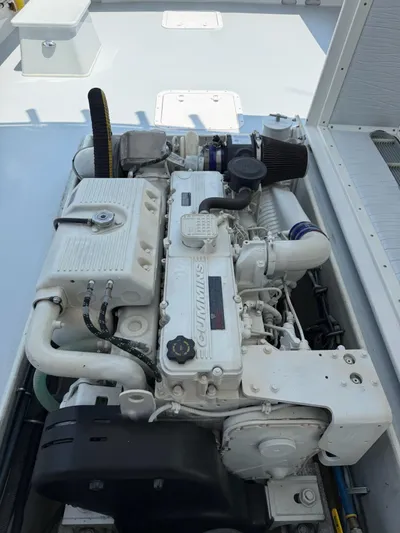 Outcast Yacht Photos Pics Engine of a 2004 Mabry 40 boat, featuring a Cummins diesel engine.