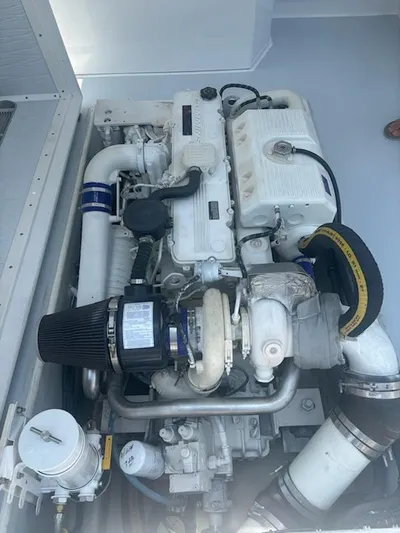 Outcast Yacht Photos Pics Mabry 40 engine, 2004 model, featuring complex piping and components in a clean compartment.