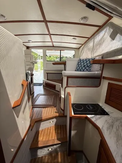 Outcast Yacht Photos Pics Interior of a 2004 Mabry 40 boat with wood accents and modern amenities.
