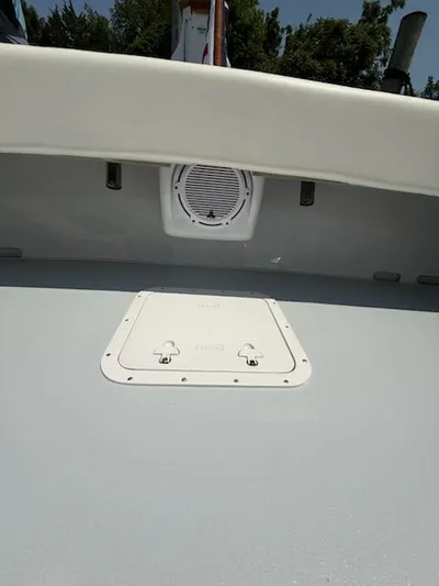 Outcast Yacht Photos Pics 2004 Mabry 40 boat interior with speaker and hatch, under clear sky.