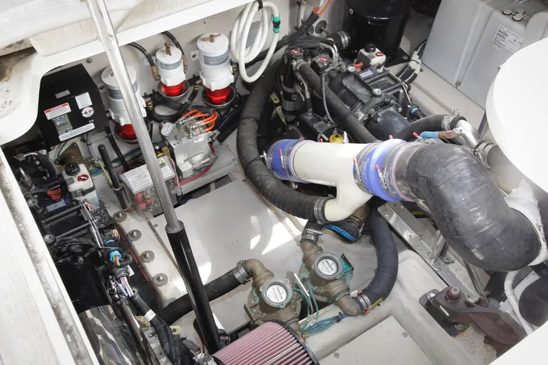 Baby Pie Yacht Photos Pics Engine room of 2016 Sea Ray 470 Sundancer, showcasing mechanical components and systems.