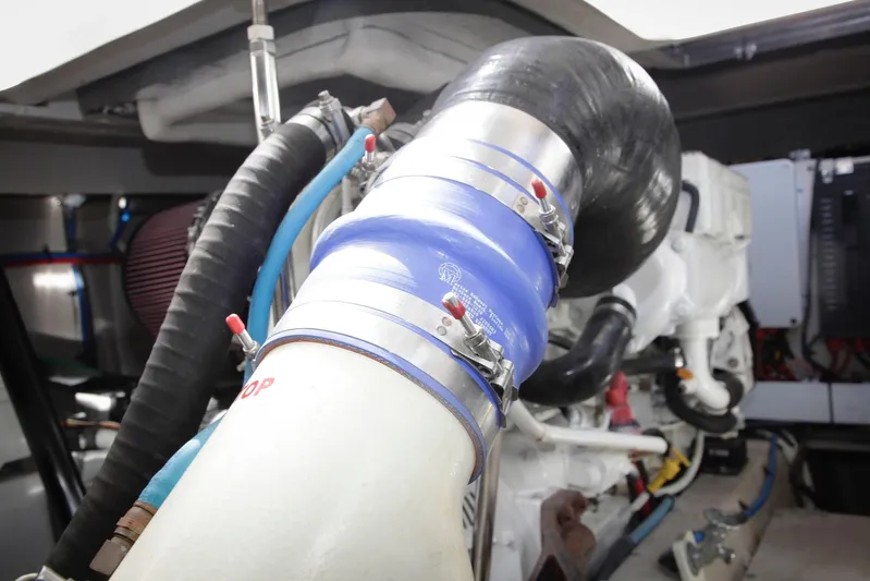 Baby Pie Yacht Photos Pics Engine compartment of 2016 Sea Ray 470 Sundancer, featuring hoses and mechanical components.