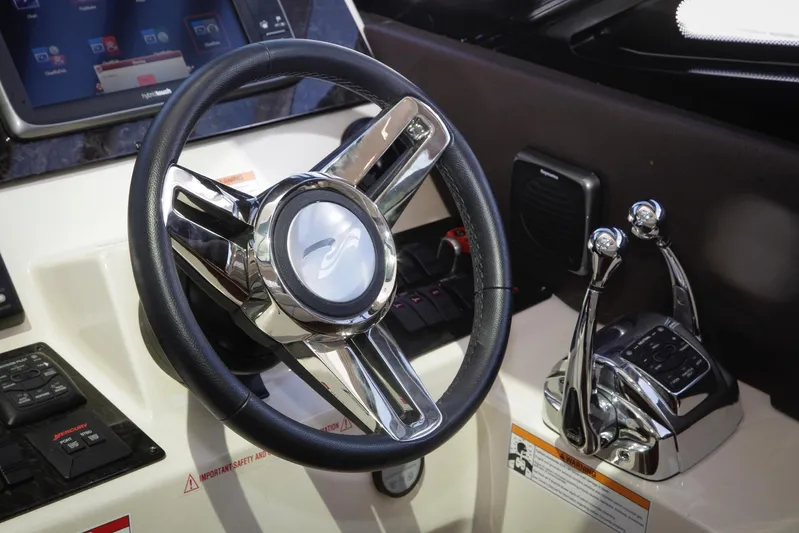 Baby Pie Yacht Photos Pics Steering wheel and controls of 2016 Sea Ray 470 Sundancer yacht cockpit.