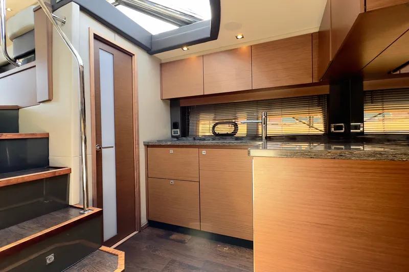 Baby Pie Yacht Photos Pics Luxurious interior of 2016 Sea Ray 470 Sundancer yacht with modern kitchen design.