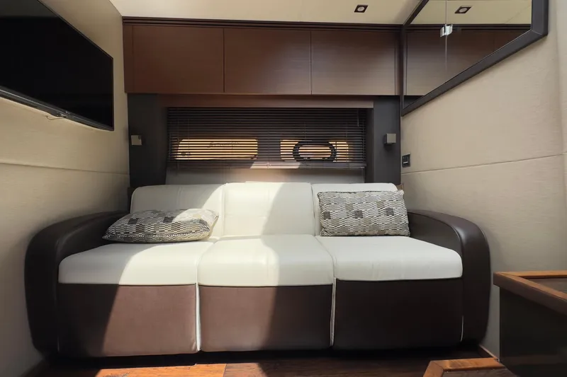Baby Pie Yacht Photos Pics Luxurious interior of 2016 Sea Ray 470 Sundancer yacht with modern sofa and decor.
