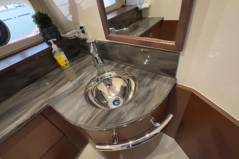 Baby Pie Yacht Photos Pics Luxurious bathroom sink in 2016 Sea Ray 470 Sundancer yacht, featuring elegant design.