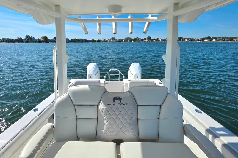  Yacht Photos Pics 2024 World Cat 325 CC boat interior with luxurious seating on calm water.