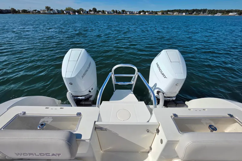  Yacht Photos Pics 2024 World Cat 325 CC boat with dual Mercury engines on open water.