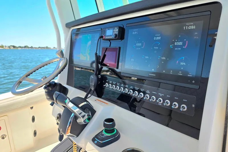  Yacht Photos Pics 2024 World Cat 325 CC boat dashboard with advanced navigation and control systems.