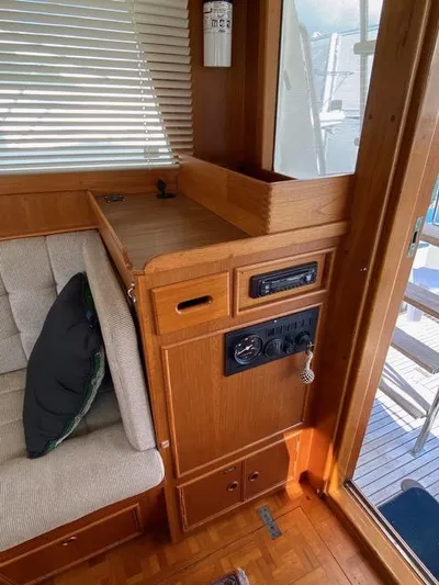  Yacht Photos Pics Interior of 1990 Grand Banks 36 Europa yacht with wooden cabinetry and seating.