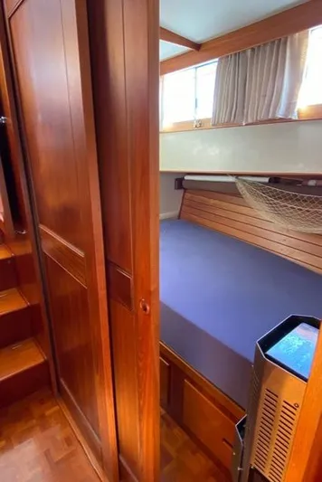  Yacht Photos Pics Cozy cabin interior of 1990 Grand Banks 36 Europa yacht with wooden furnishings.