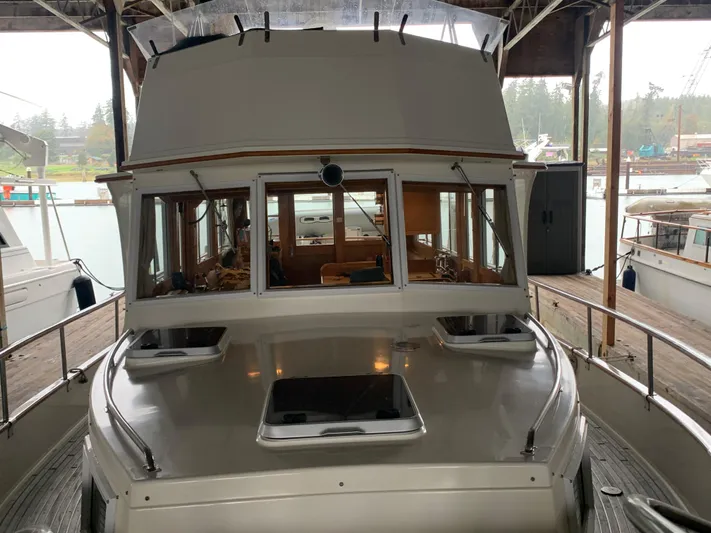  Yacht Photos Pics 1990 Grand Banks 36 Europa yacht docked in a marina, front view.