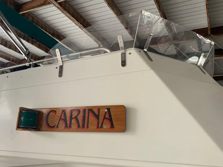  Yacht Photos Pics 1990 Grand Banks 36 Europa boat named "Carina" in a covered dock.