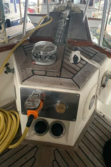  Yacht Photos Pics Control panel of a 1990 Grand Banks 36 Europa boat with ropes and equipment.