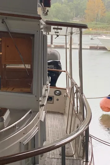  Yacht Photos Pics Side view of 1990 Grand Banks 36 Europa yacht docked at marina.