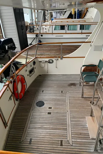  Yacht Photos Pics 1990 Grand Banks 36 Europa yacht deck with wooden flooring and seating area.