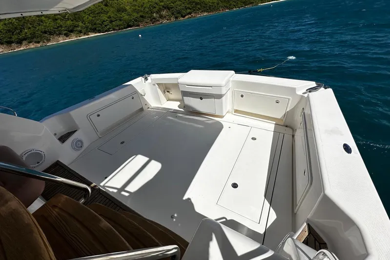  Yacht Photos Pics Riviera 43 Flybridge 2012 yacht deck with ocean view and storage compartments.