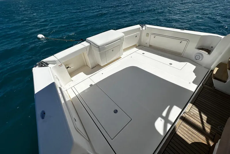  Yacht Photos Pics Spacious deck of 2012 Riviera 43 Flybridge yacht on calm blue water.