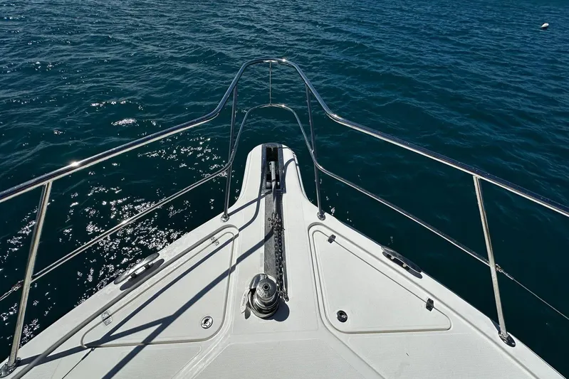  Yacht Photos Pics Bow view of 2012 Riviera 43 Flybridge yacht on open water.