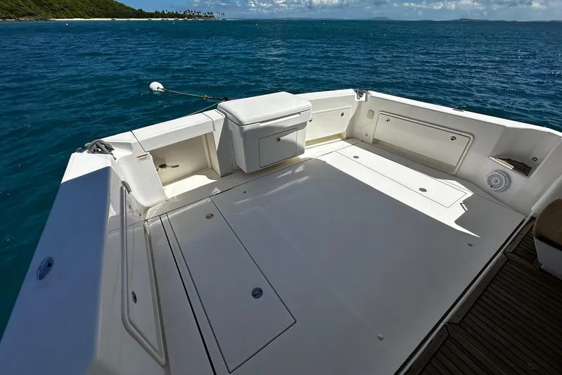  Yacht Photos Pics Riviera 43 Flybridge 2012 yacht deck with ocean view and storage compartments.