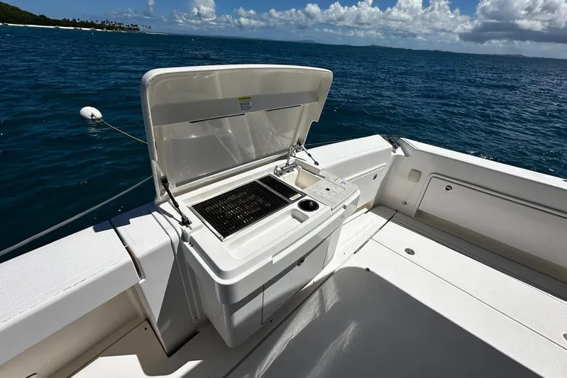  Yacht Photos Pics Outdoor grill on 2012 Riviera 43 Flybridge yacht, ocean view in background.