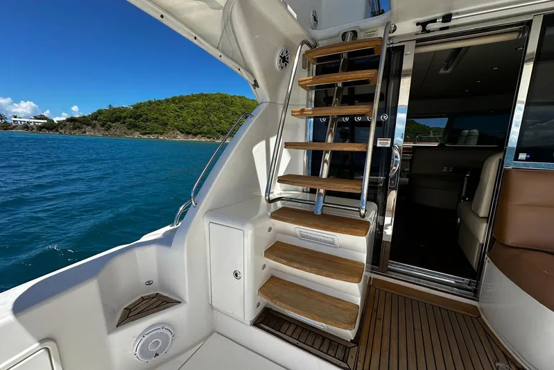  Yacht Photos Pics Riviera 43 Flybridge 2012 yacht interior with wooden stairs and ocean view.