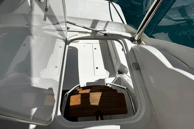  Yacht Photos Pics 2012 Riviera 43 Flybridge yacht interior with wooden steps and sleek white design.