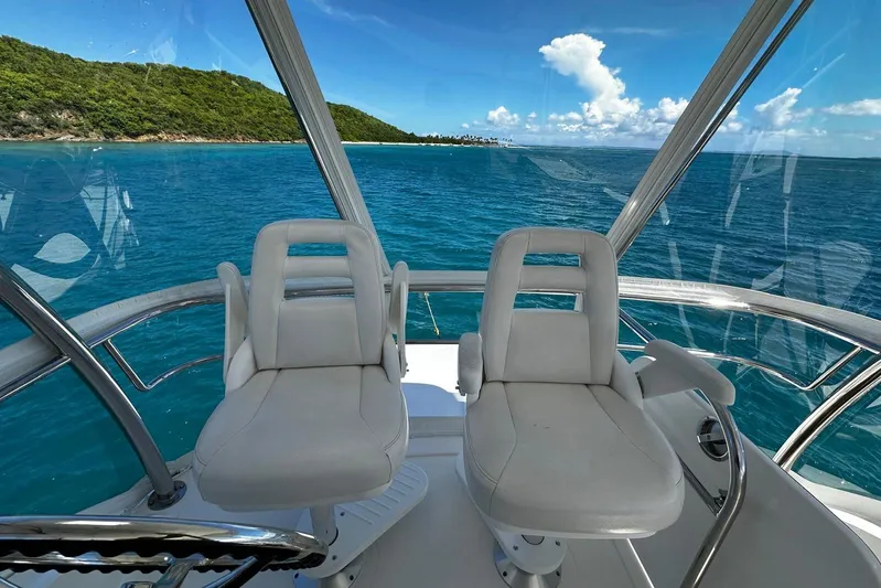  Yacht Photos Pics Flybridge view from 2012 Riviera 43, overlooking ocean and lush coastline.