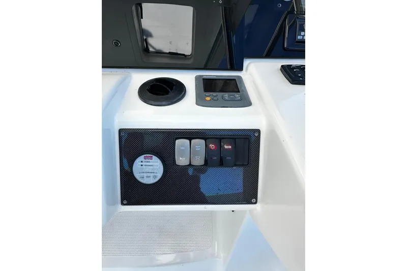  Yacht Photos Pics Control panel of 2012 Riviera 43 Flybridge yacht with switches and display.