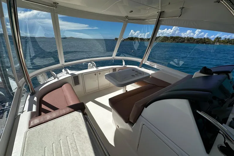  Yacht Photos Pics Luxurious 2012 Riviera 43 Flybridge interior with ocean view and comfortable seating.